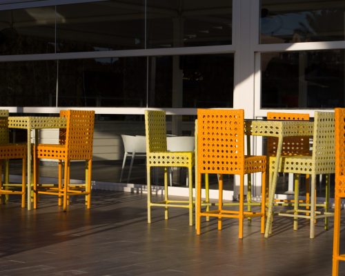 wicker-chairs-lunch-summer-cafe-with-glass-wall-outdoor-terrace-sunny-day (1)